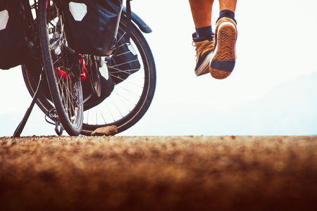 Cyclist legs on mountain trail. Sport and active life concept