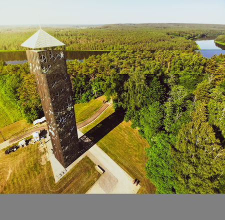 Tourist stand on top look out Birstonas observation tower - highest such tower in Lithuania. Drone...