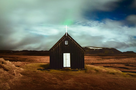 Iceland - march 13, 2023: KrÃ½suvÃ­kurkirkja, a historic church. Northern lights in Krysuvikurkirkja in Reykjanes peninsula, Icelandの写真素材