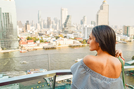 Attractive elegant woman tourist wear dress enjoy shopping mall look out famous viewpoint over river...
