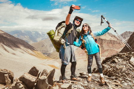couple take selfie in mountainsの写真素材