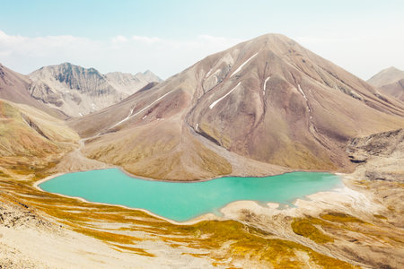 Aerial panoramic view Kelitsadi lake panorama. Keli volcanic plateau. Kazbegi national park....