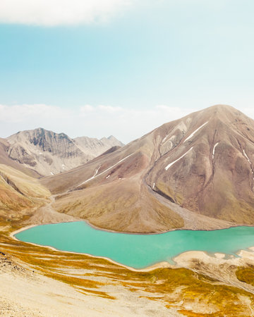 Aerial panoramic view Kelitsadi lake panorama. Keli volcanic plateau. Kazbegi national park. Caucasus mountains.Georgia famous hiking destination.Sunny summer day highlands caucasus pristine mountainsの写真素材