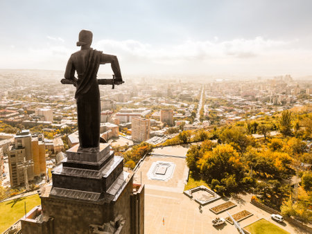 Yerevan, Armenia - 19th october, 2024: Aerial close up face view Mother Armenia statue. Female personification of Armenia. Famous high monumental statue in Victory Park overlooking the capital cityの写真素材