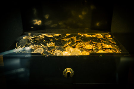 Close up many golden new euro coins in treasure chest. Many Euro coins in box. Banking and inflation concept. 3D rendered animation.の写真素材