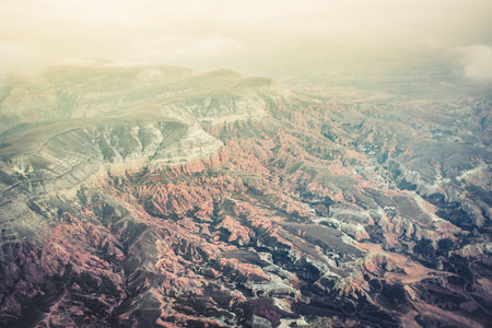Famous Red rose kapadokya valleys landscape. Top down aerial birds eye view. Goreme national park. Cappadocia. Turkey travel destination. Natural wonder in asiaの写真素材