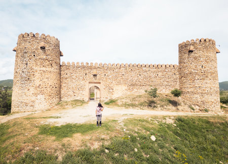 Aerial view tourist sightseeing Chailuri Castle or Niakhura Fortress. Eastern Georgia. Medieval...