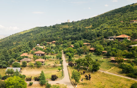 Aerial panorama old Traditional Georgian architecture wooden houses towers displayed in Giorgi Chitaia Open Air Museum of Ethnography in Tbilisi. Cultural heritage site on Tbilisi hills Vake district.の写真素材