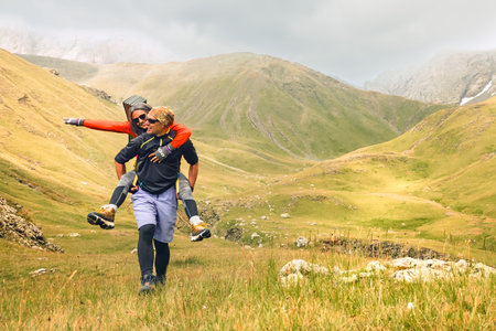 Man and woman on the background of mountains. A man and a woman on the background of mountains.