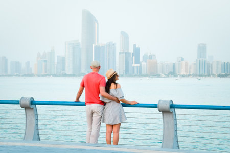 Caucasian tourist romantic couple stand together enjoy skyline panorama on scenic viewpoint in Abu...