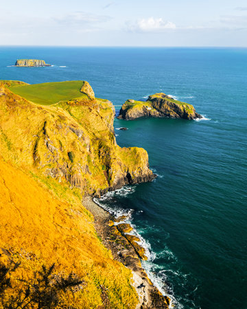 Landscape with rugged limestone cliffs and Atlantic Ocean under blue sky, scenic geopark.の写真素材