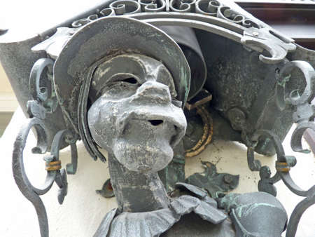Devil, sculpture on a wallの写真素材