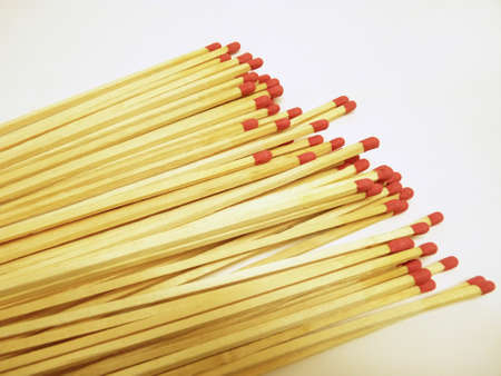 Matchsticks with red head on white backgroundの写真素材