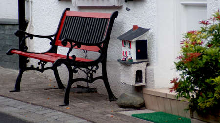 Bench in front of the houseの写真素材