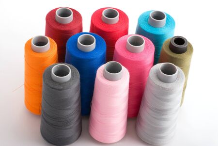 close-up of multy color bobin threadsの写真素材
