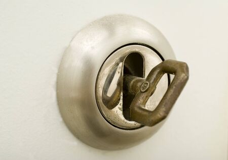 door lock with key on white wooden doorの写真素材
