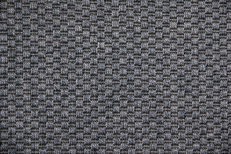 background closeup of dark grey rug flatwoven carpet
