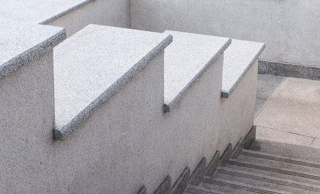 City ladder from a gray stone and granite. A ladder in the city. Granite ladder. Stone ladder. Texture. Backgroundの写真素材