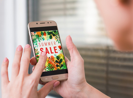 A woman is shopping at the online store. front viewの写真素材