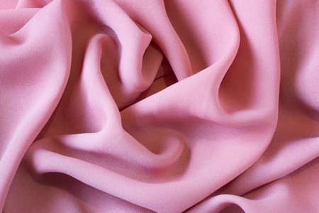 Pink fabric texture for background and design, beautiful pattern of silk or linen. Top viewの写真素材
