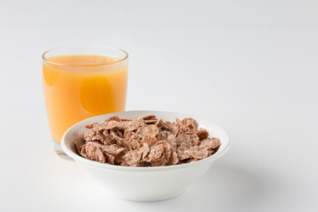 Bowl of multigrain natural flakes  on a white background. Healthy food. Top view.の写真素材