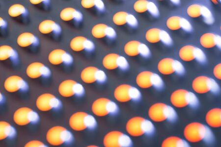 Texture of metal kitchen grater out of focus. Close-up. Abstract backgroundの写真素材