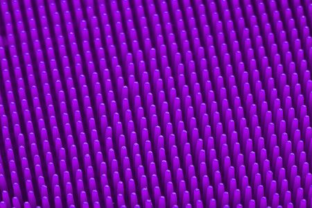 Violet silicone massage brash surface texture close up for background. Top view. Macroの写真素材