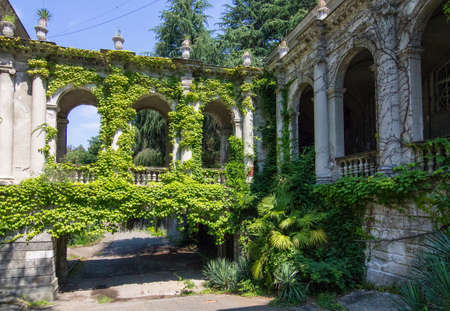 RUSSIA, SOCHI - JULY 25, 2020: Beautiful old building of the sanatorium named after Sergo Ordzhonikidze with tropical vegetation on a sunny summer day. Architect Ivan Sergeevich Kuznetsovのeditorial素材