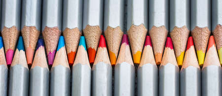 Colored wooden pencils close-up. Top view.の写真素材