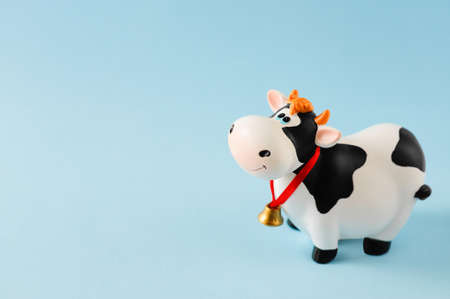 Toy bull on the blue background. Symbol of the Chinese New year 2021. New years mood.の写真素材