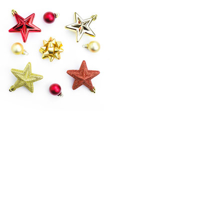 Christmas tree toys, red and gold stars, balls on a white background. Copy spaceの写真素材
