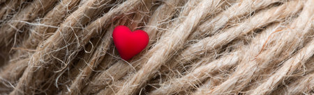 Red heart on the surface of the twine. Valentines Day background. Macroの写真素材