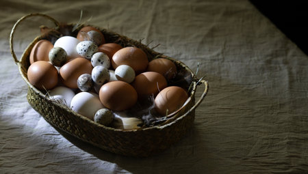 Easter zero waste. Chicken and quail eggs in a basket on a coarse linen tablecloth. Cozy religious...