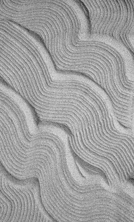 Abstract texture of gray sand. Pattern of sand waves as a backgroundの写真素材
