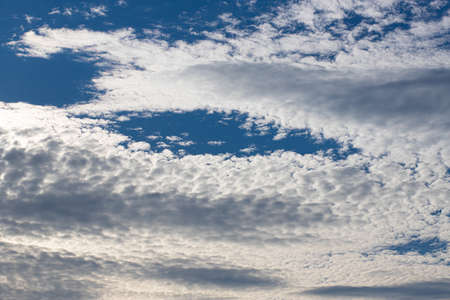Clouds in the blue sky for background and texture. The summer heaven, colorful clearing day, beautiful morning.の写真素材