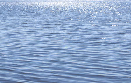 Seawater surface as background on a sunny day.の写真素材