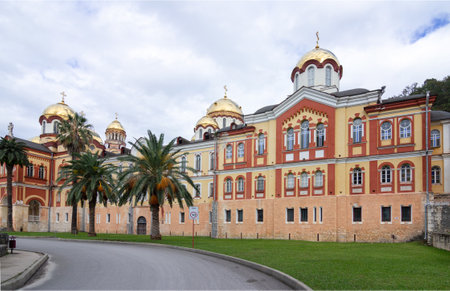 New Athos, Abkhazia - October 20, 2021. The New Athos Monastery with bright golden domes on a sunny...