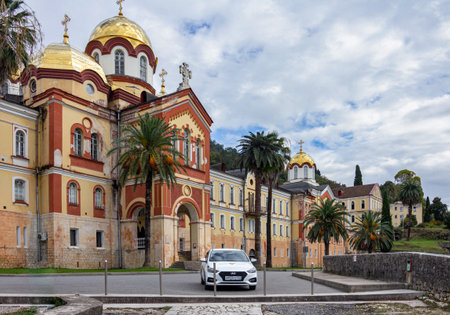 New Athos, Abkhazia - October 20, 2021. The New Athos Monastery with bright golden domes on a sunny...