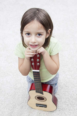 music instrument - little girl with guitarの写真素材