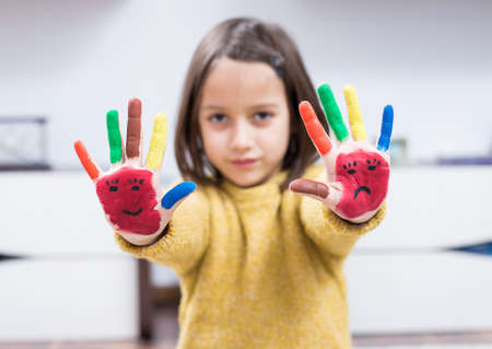 Little girl with painted handの写真素材