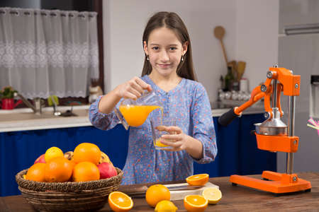 making a fresh orange juiceの写真素材