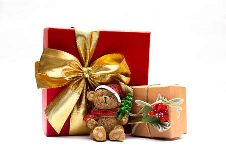 Christmas gift box and teddy bear isolated on a white background.の写真素材