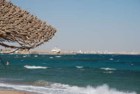Umbrella on the beach with sea behindの写真素材