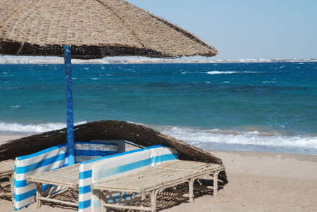 Umbrella on the beach with sea behindの写真素材