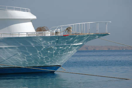 Docked boat in sea port, read sea