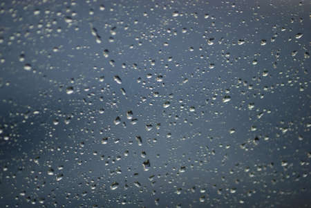 Rain drops on glass close up nice background conceptの写真素材
