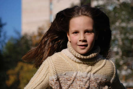 Quickly runing little girl, to go in for sportsの写真素材