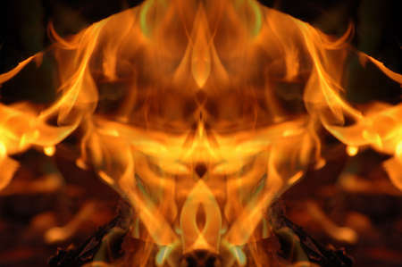 Abstract hot fire peacock feather on dark backgroundの写真素材