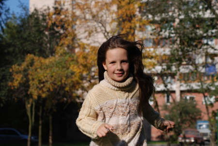 Quickly runing little girl, to go in for sportsの写真素材