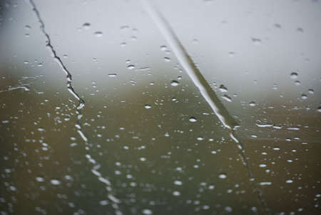 Rain drops on glass close up nice background conceptの写真素材